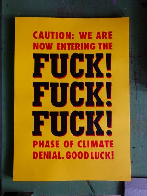 Plakat in rot und schwarz auf dem steht: Caution: We are Not entring the FUCK! FUCK! FUCK! Phase of climate denial. Good Luck!